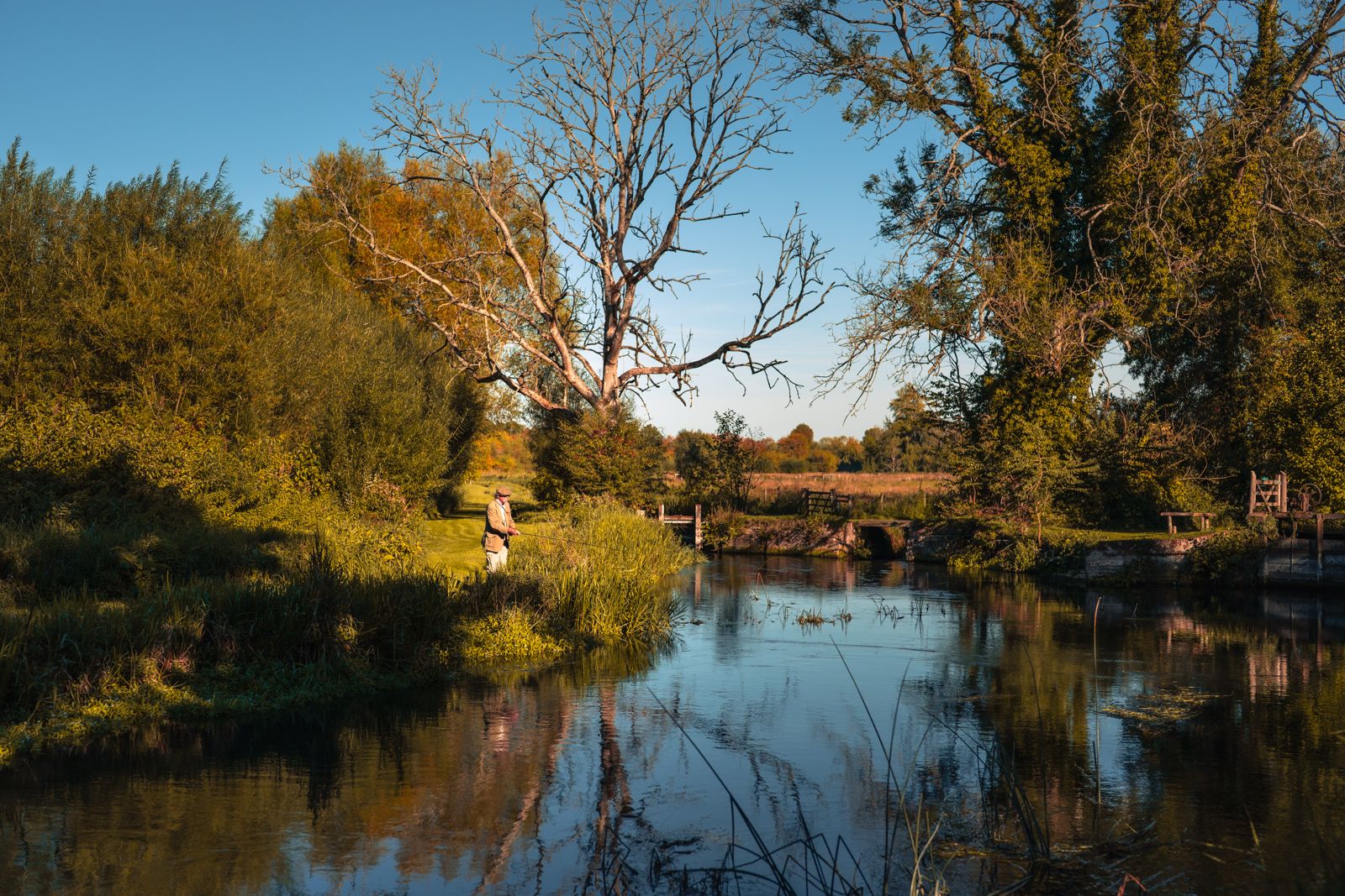 reflection of fisherman on the Kennet river